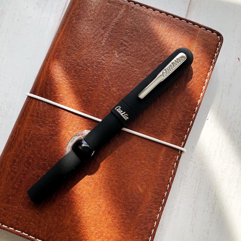 conklin mark twain superblack crescent filler limited edition fountain pen review on leather journal