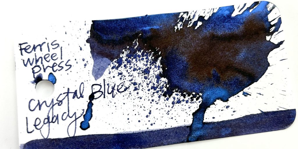 Crystal Blue Legacy ink splash on Col-o-ring ink testing card.