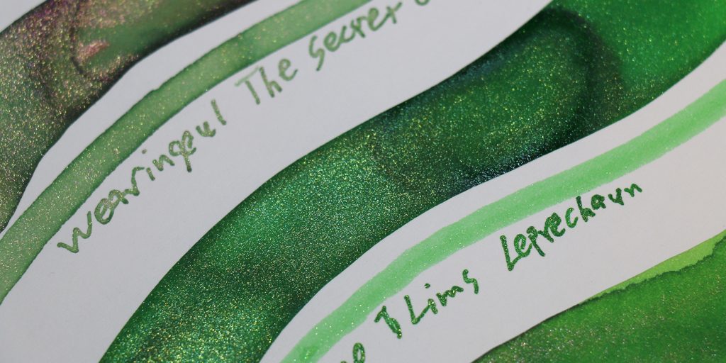 Green ink swatches showing gold shimmer from Tono & Lims Leprechaun and Wearingeul The Secret Garden