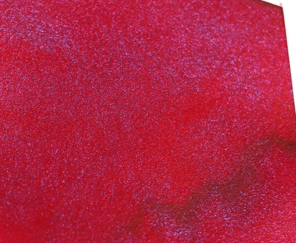 Wearingeul Dracula ink swatch macro closeup look at the crimson red ink base iced over with the pale blue shimmer. 