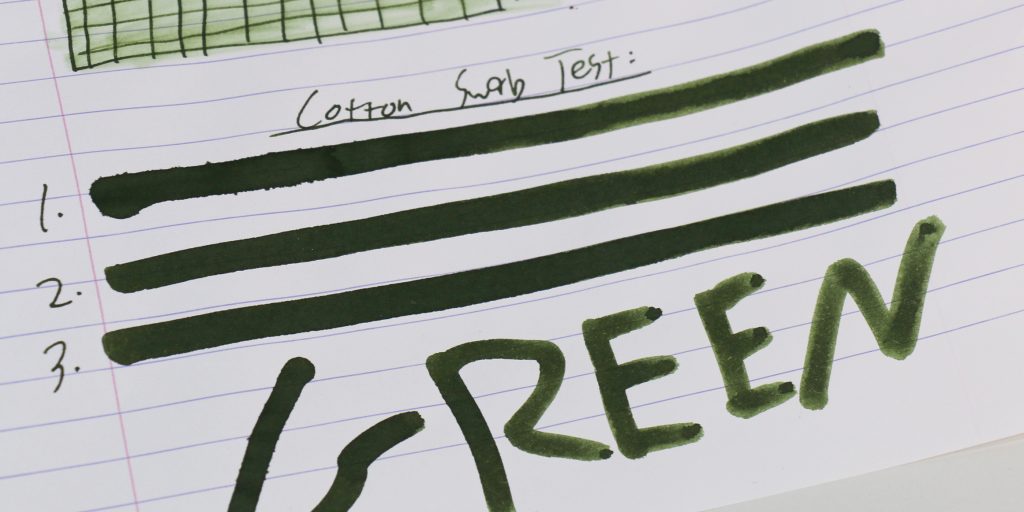 Monteverde Olivine ink cotton swab test showing color variation.
