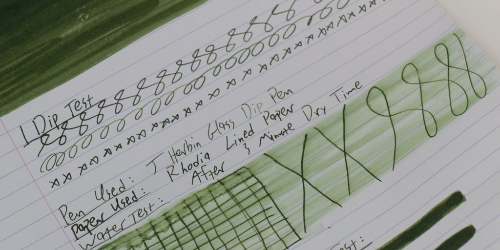 Monteverde Olivine ink water test showing minimal fading and strong line retention.