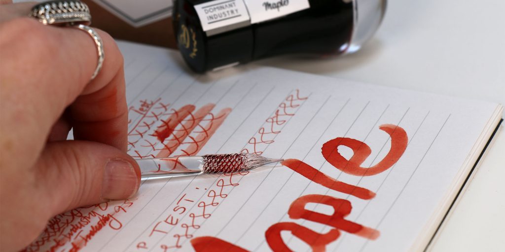 Dominant Industry Maple Ink Review test results with the ink bottle, ink packaging, and the Muddler glass dip pen used during the ink review. 