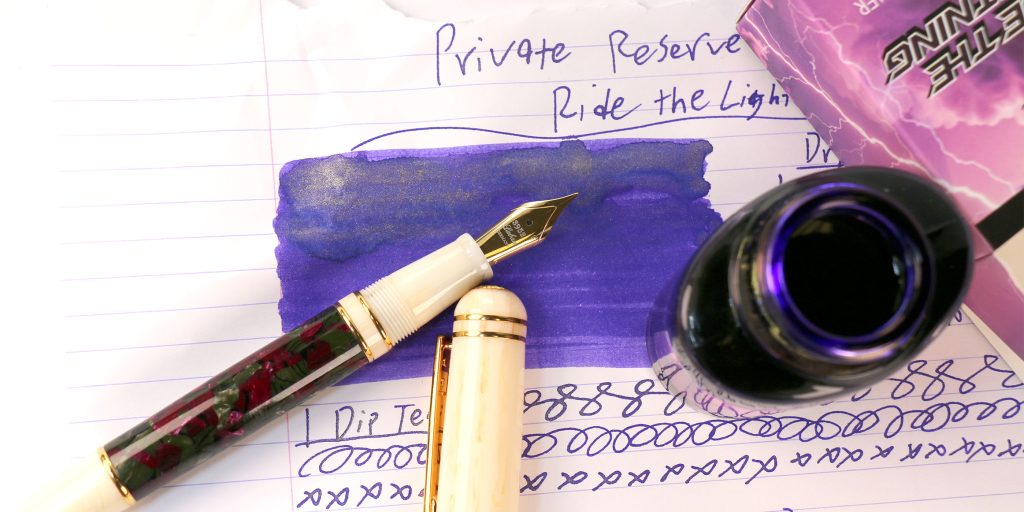 Ride the Lightning ink from above with a Laban 325 Damask Celluloid fountain pen resting on the ink's swatch/ink review test results.