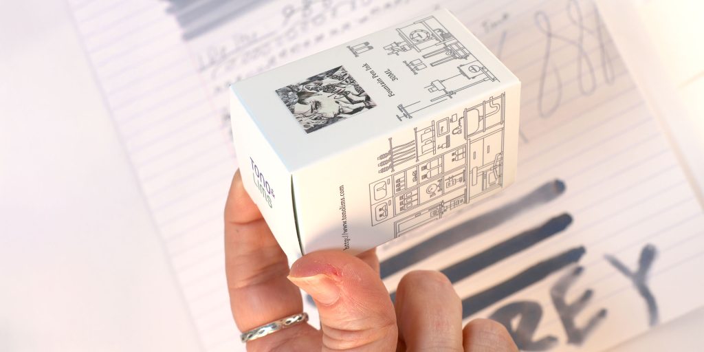 Tono and Lims 30ml inks are in the classic Tono and Lims white cardboard box with a city skyline sketched in black. The front includes an ink label. 