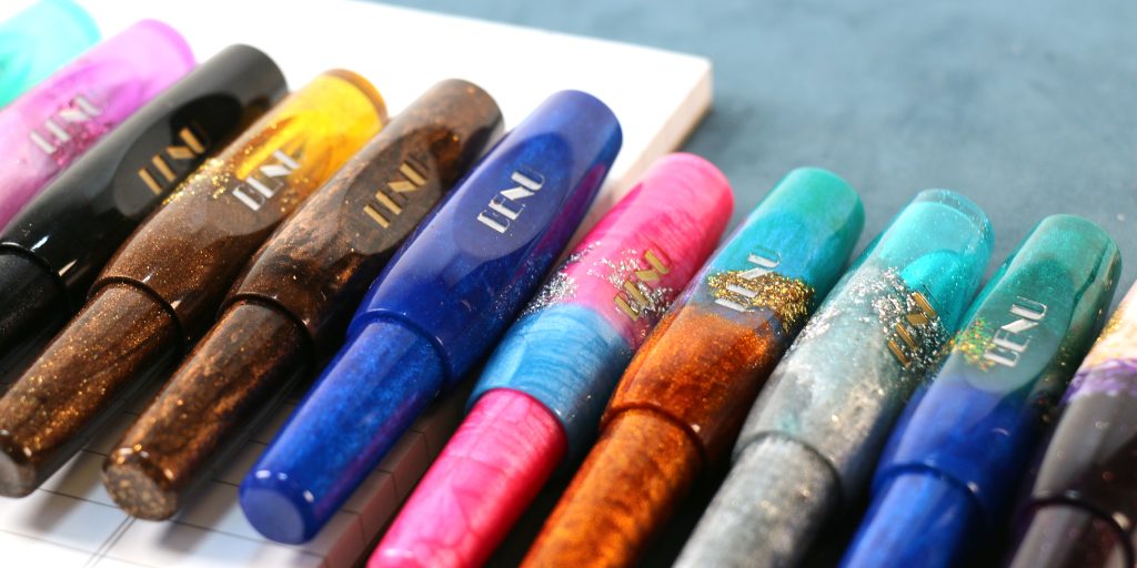 The Benu Pixie Collection of fountain pens shown capped side by side showcasing the many colors.