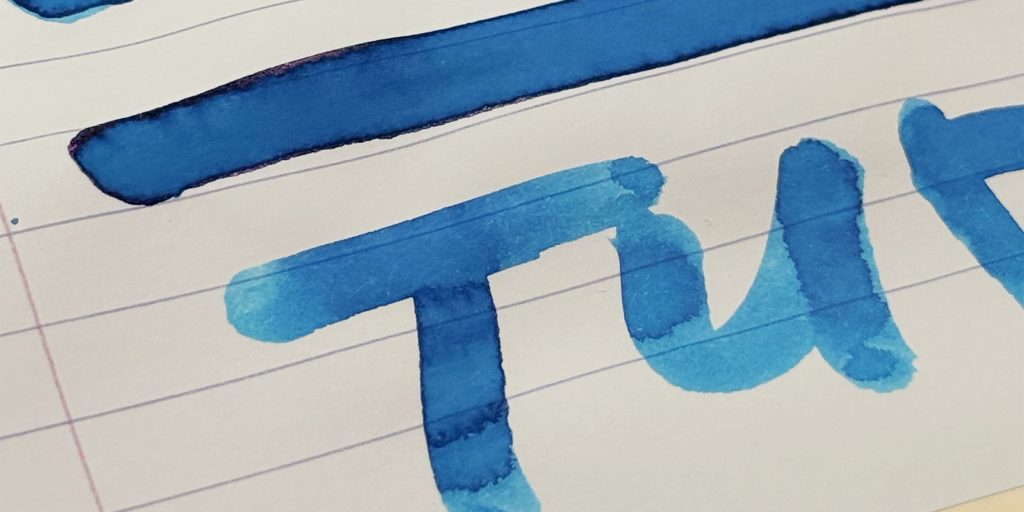 Pelikan 4001 Turquoise cotton swab ink swatch on Rhodia lined paper.