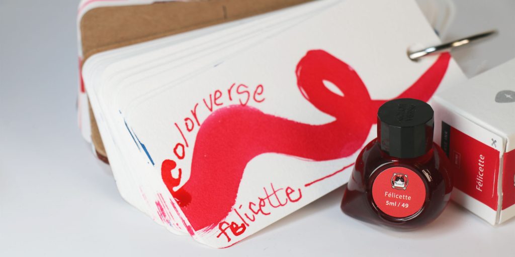 Coloverse Felicette ink swatch on a Col-o-ring ink swatch card wit hthe ink bottle in front of the card, the mini 5ml ink bottle.
