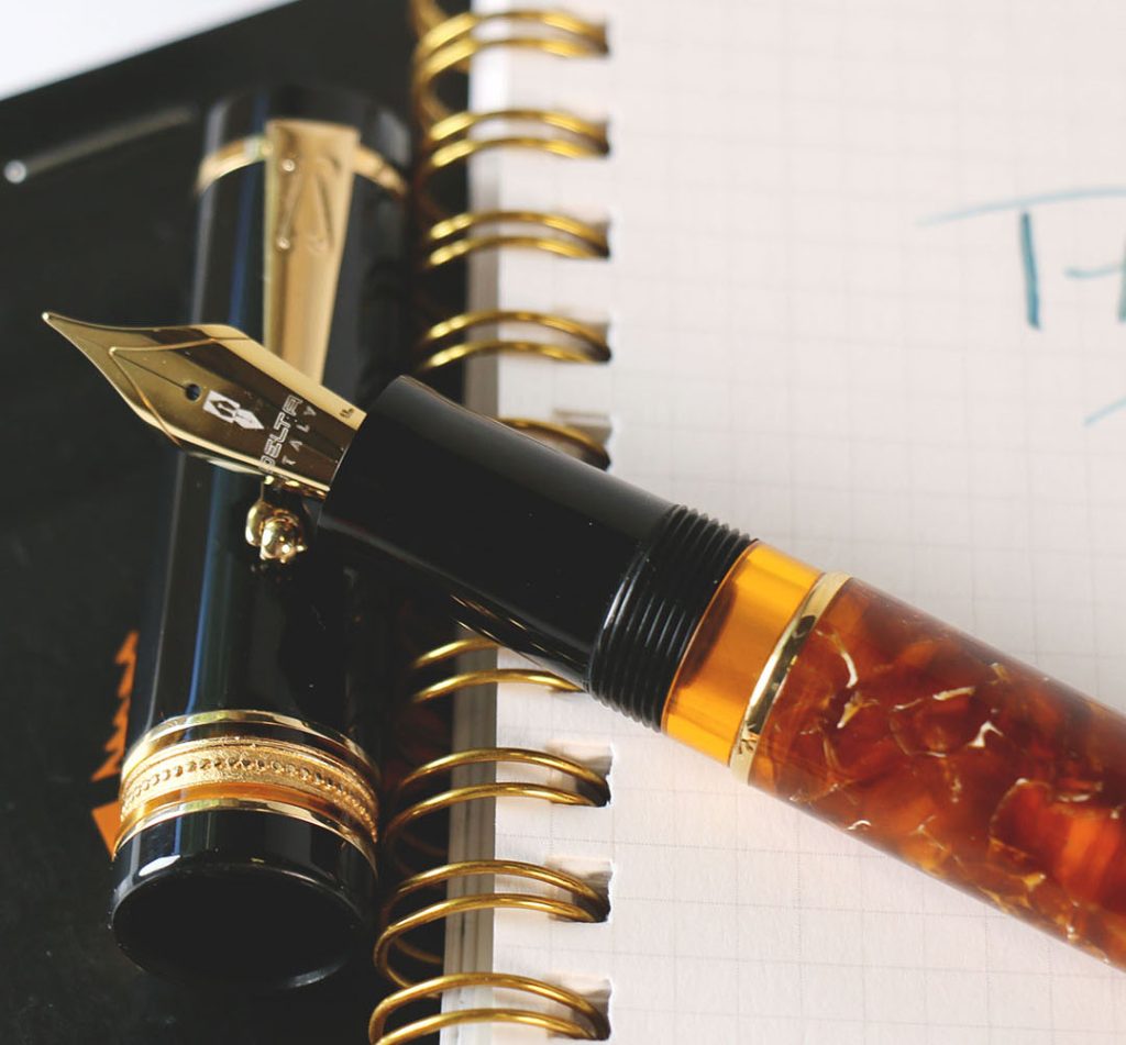 delta dv original midsize exclusive amber fountain pen uncapped uncle festers pick in the wednesday pen flicks pen quide