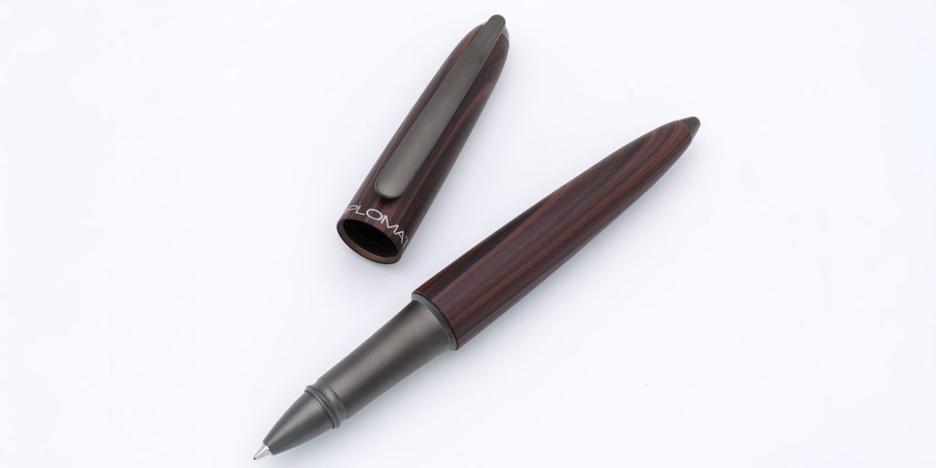 Diplomat Aero Black Forest rollerball pen uncapped on a white background.