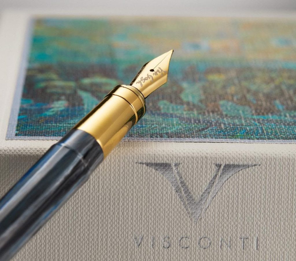 Visconti Van Gogh Prisoner's Round Collection fountain pen uncapped showing nib against the custom pen box featuring the art that inspired the luxury pen release.