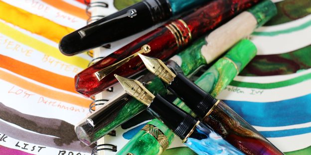 An assortment of Pen Chalet's Exclusive fountain pen releases that dropped in spring 2026 and Summer 2026 on top of a page of fountain pen ink swatches.
