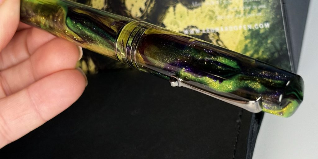 Leonardo Officina Italiana Momento Zero Grande 2.0 Zombie fountain pen in hand showing the shimmering partially translucent Brooks resin.