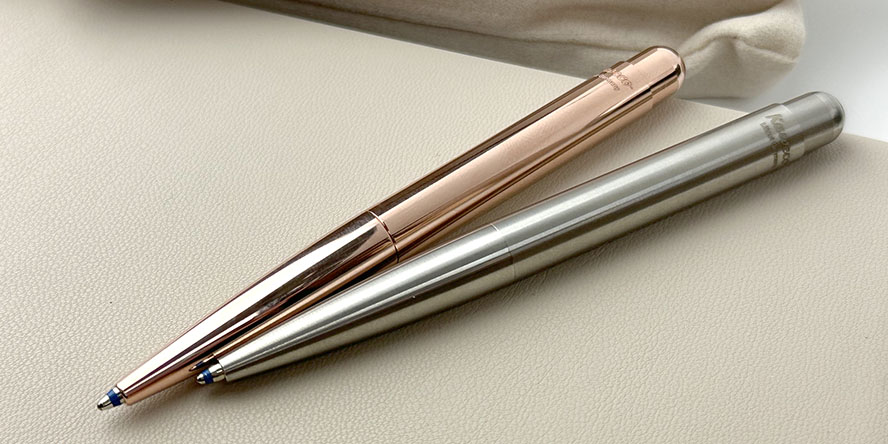 kaweco_liliput_ballpoint_pens_copper_stainless_steel_on_notebook