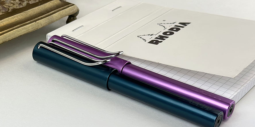 lamy_2023_special_edition_al_star_lilac_and_petrol_fountain_pens_capped_side_by_side