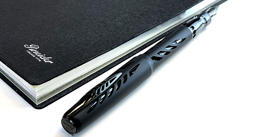 pineider_arman_aluminum_fountain_pen_posted_with_pineider_milano_notebook