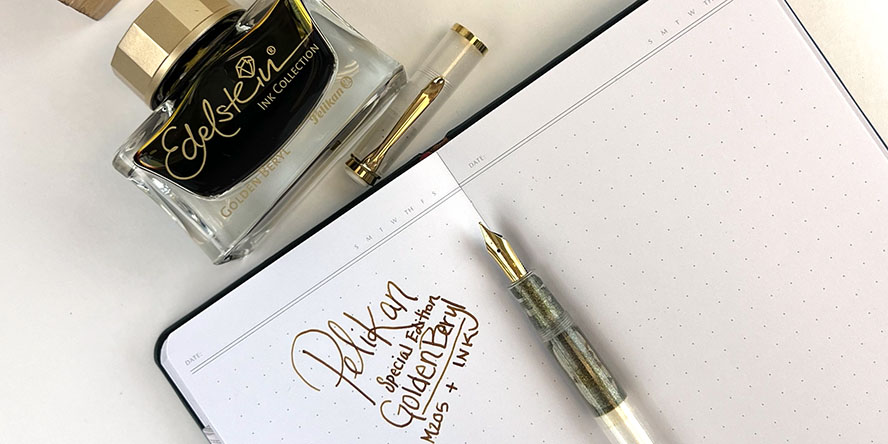 pelikan_m200_golden_beryl_ink_and_fountain_pen_special_edition_in_notebook