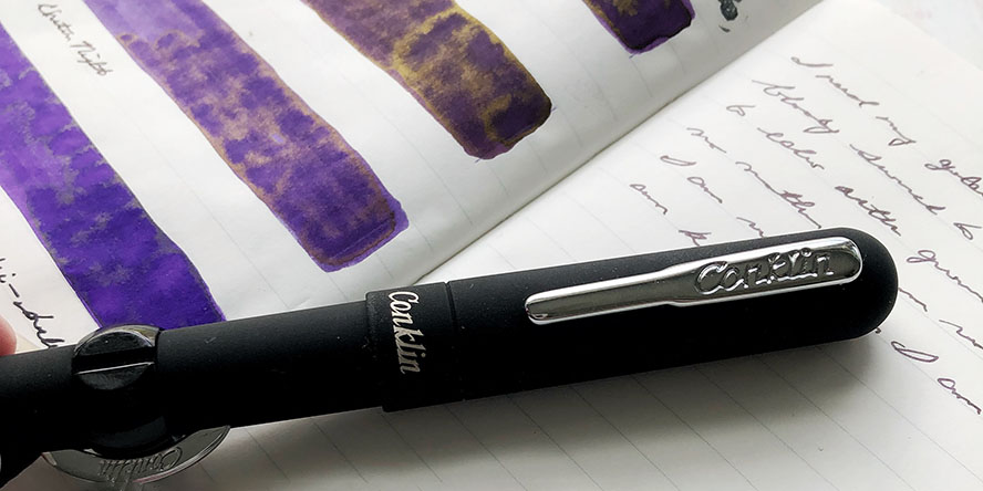conklin_mark_twain_crescent_filler_superblack_fountain_pen_with_purple_ink_swatches