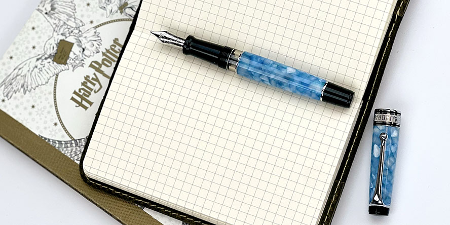 aurora_optima_365_celeste_blue_fountain_pen_uncapped