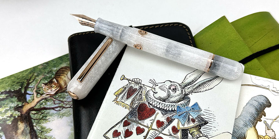 nahvalur_rabbit_2023_pen_of_the_year_nautilus_fountain_pen_on_white_rabbit_and_alice_notebooks